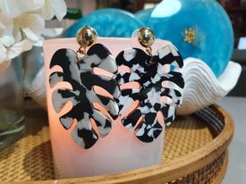 Large black white and gold monstera leaf shaped earrings
